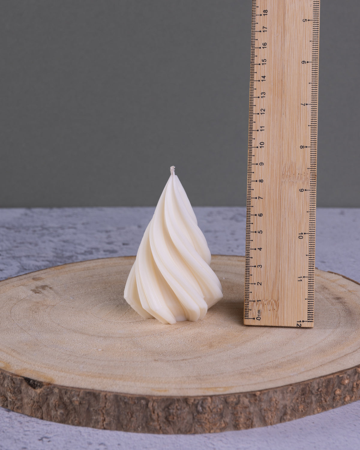 Small sculptural twist christmas tree candle showing measurement
