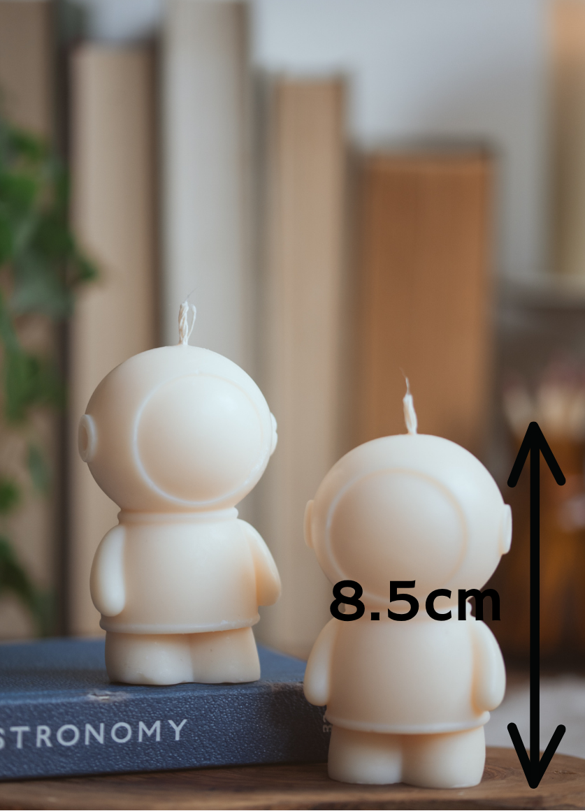 Spaceman shaped candle with measurement