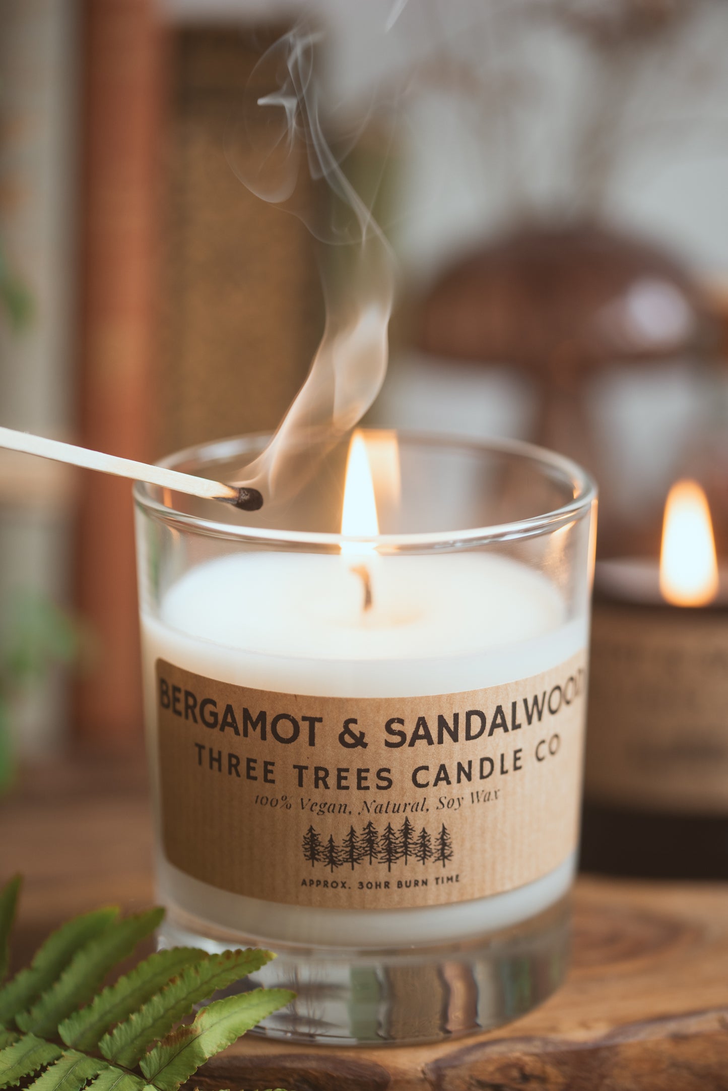 Bergamot and sandalwood candle burning