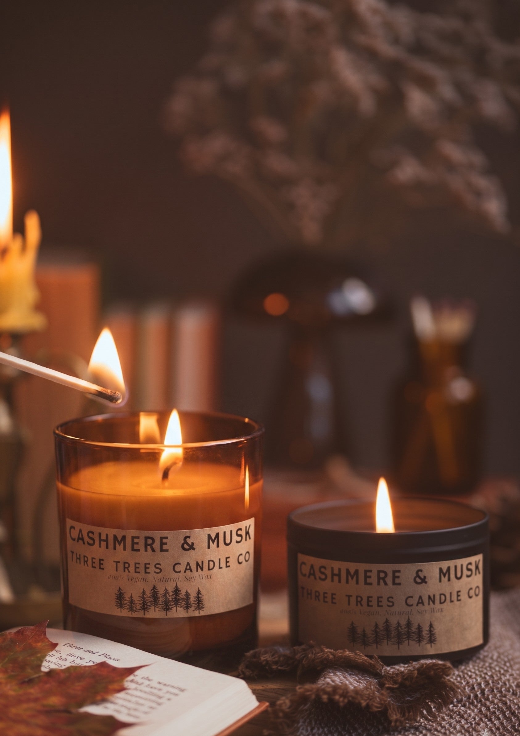 cashmere and musk scented candle in amber glass and tin