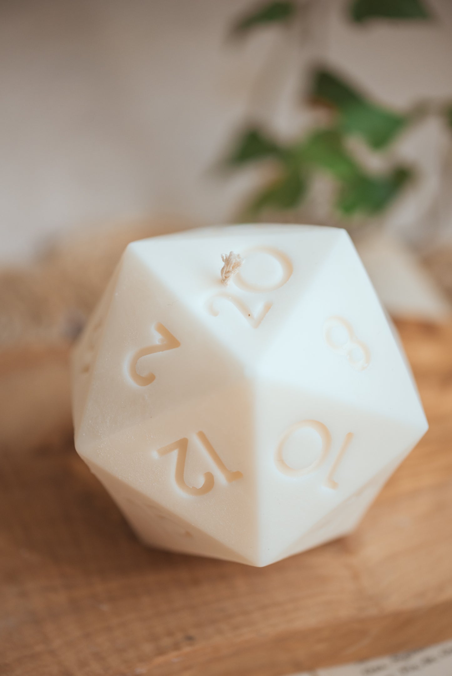 Close-up of D20 candle showing numbered facets