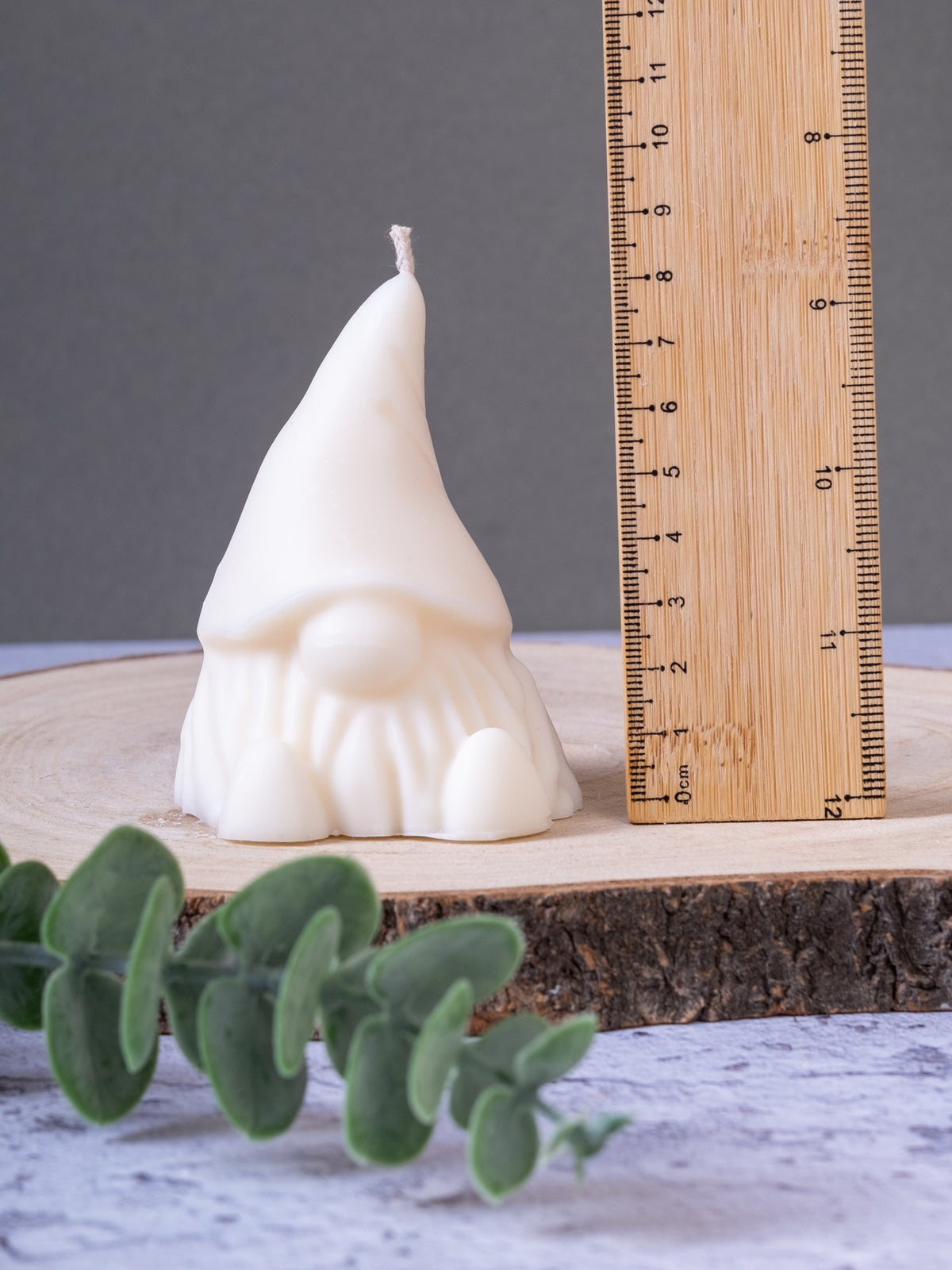 Close-up of gonk candle showing measurement