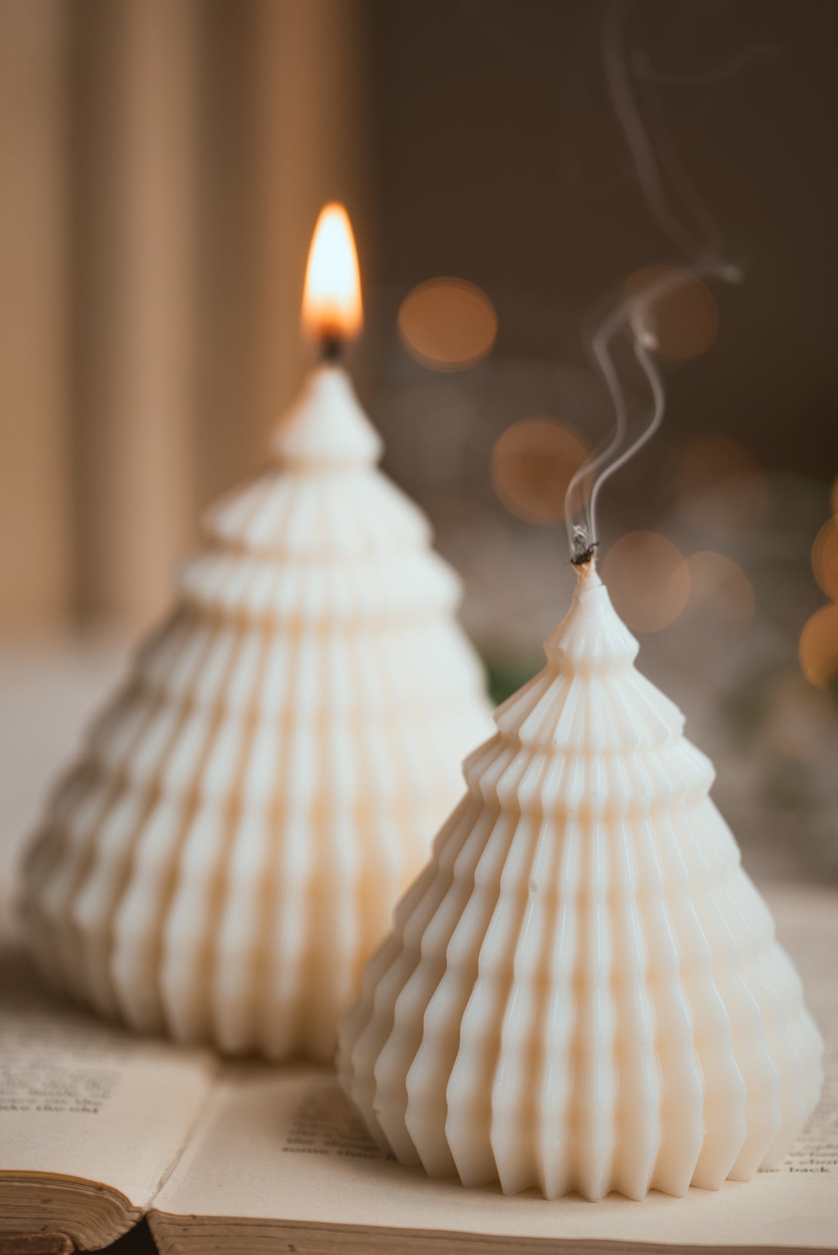 Close-up of layered Christmas tree candle showing tiered wax layers