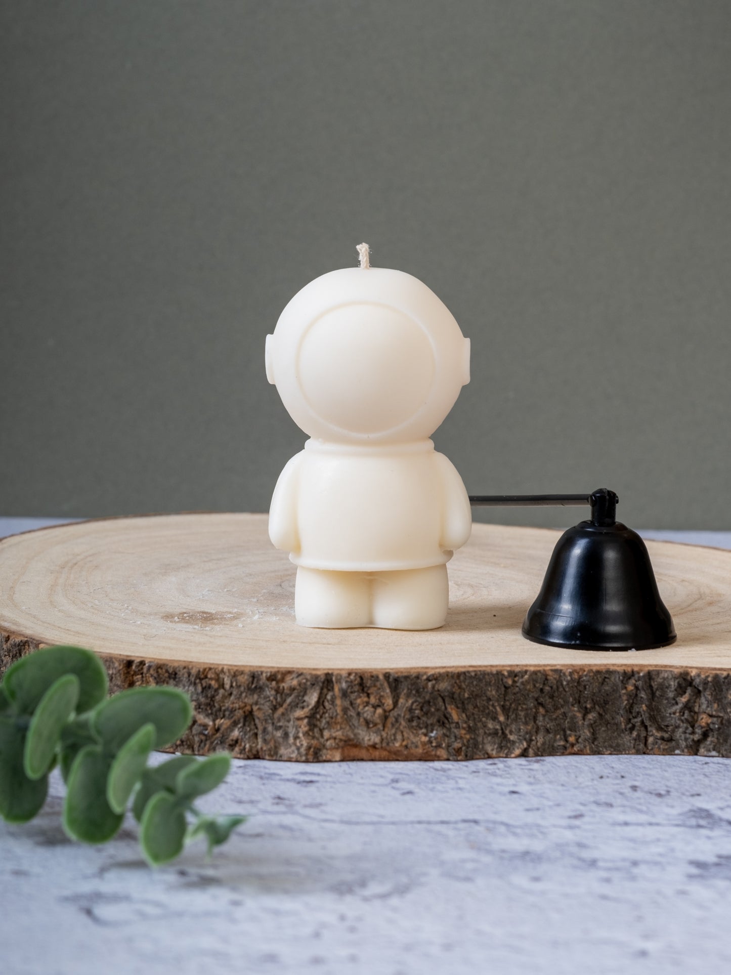 Close-up of spaceman-shaped candle showing details
