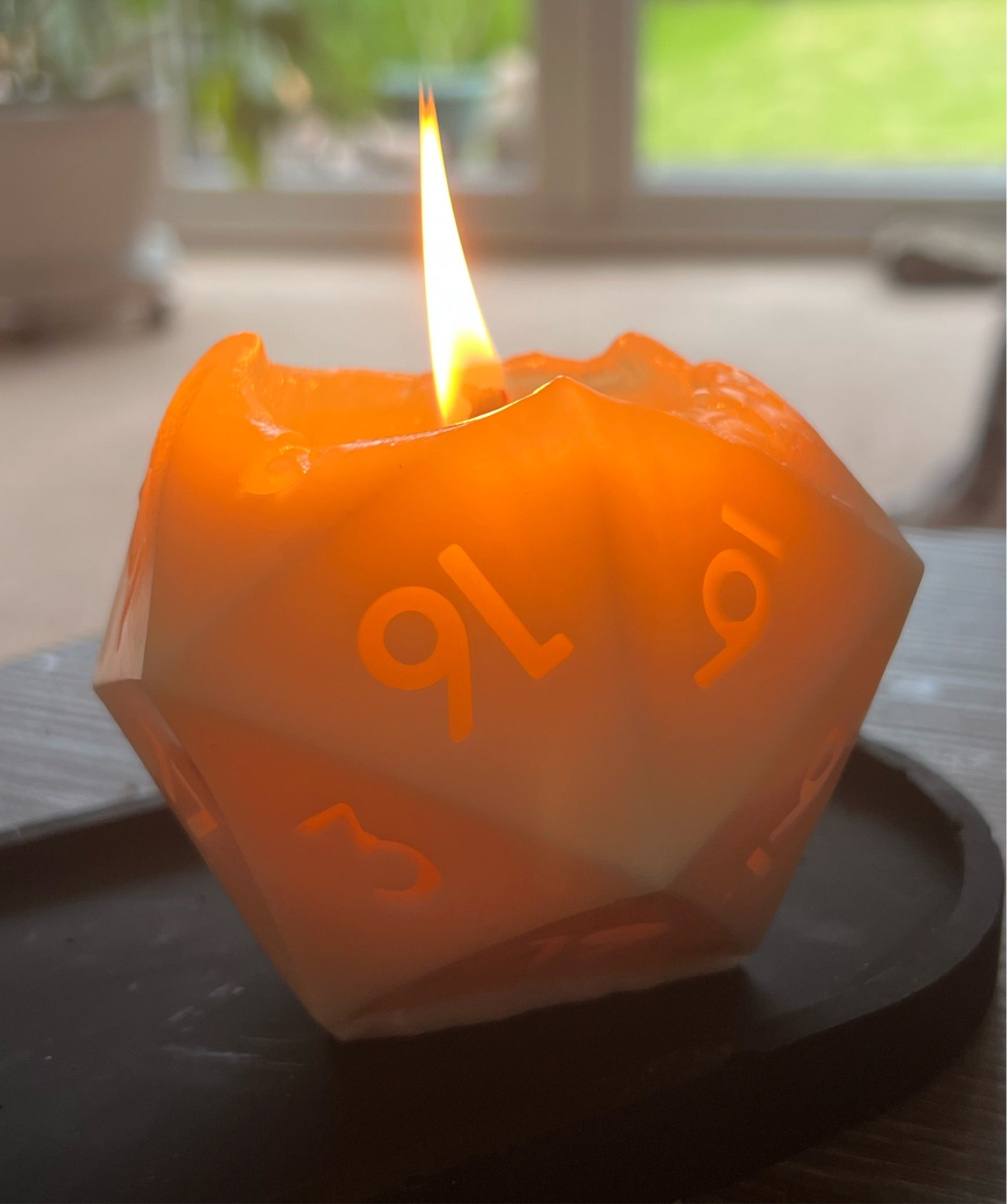 D20 soy wax candle burning with cotton wick