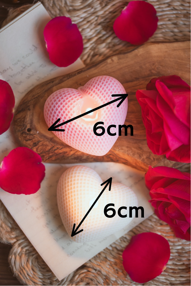 heart shaped pink and white candle showing measurement