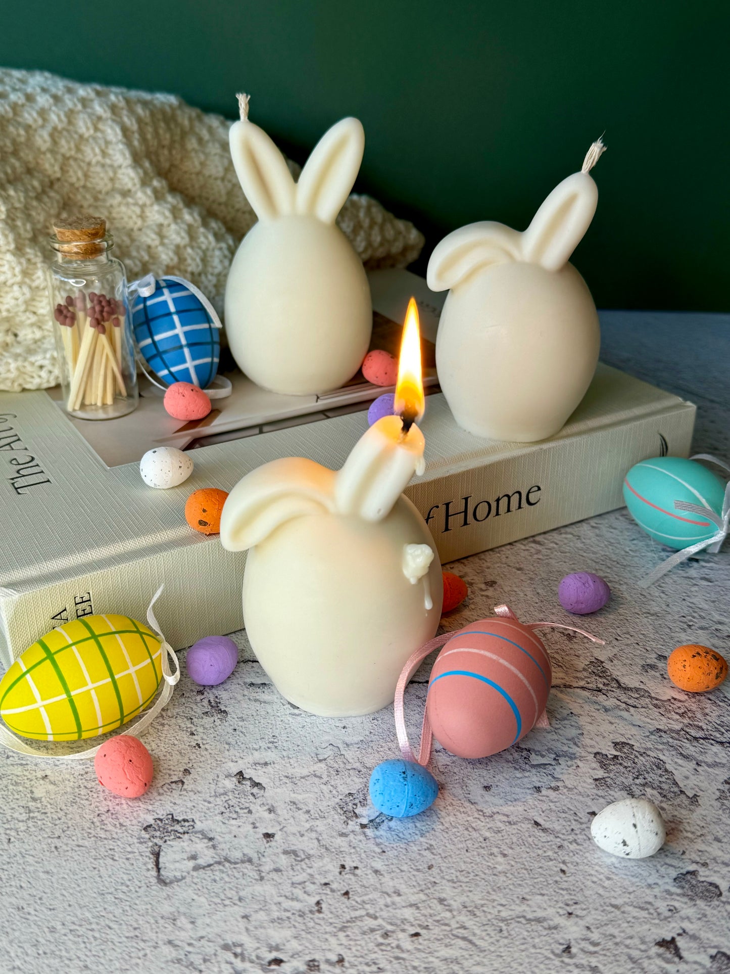 Lit Easter egg bunny soy candle creating cozy spring ambiance