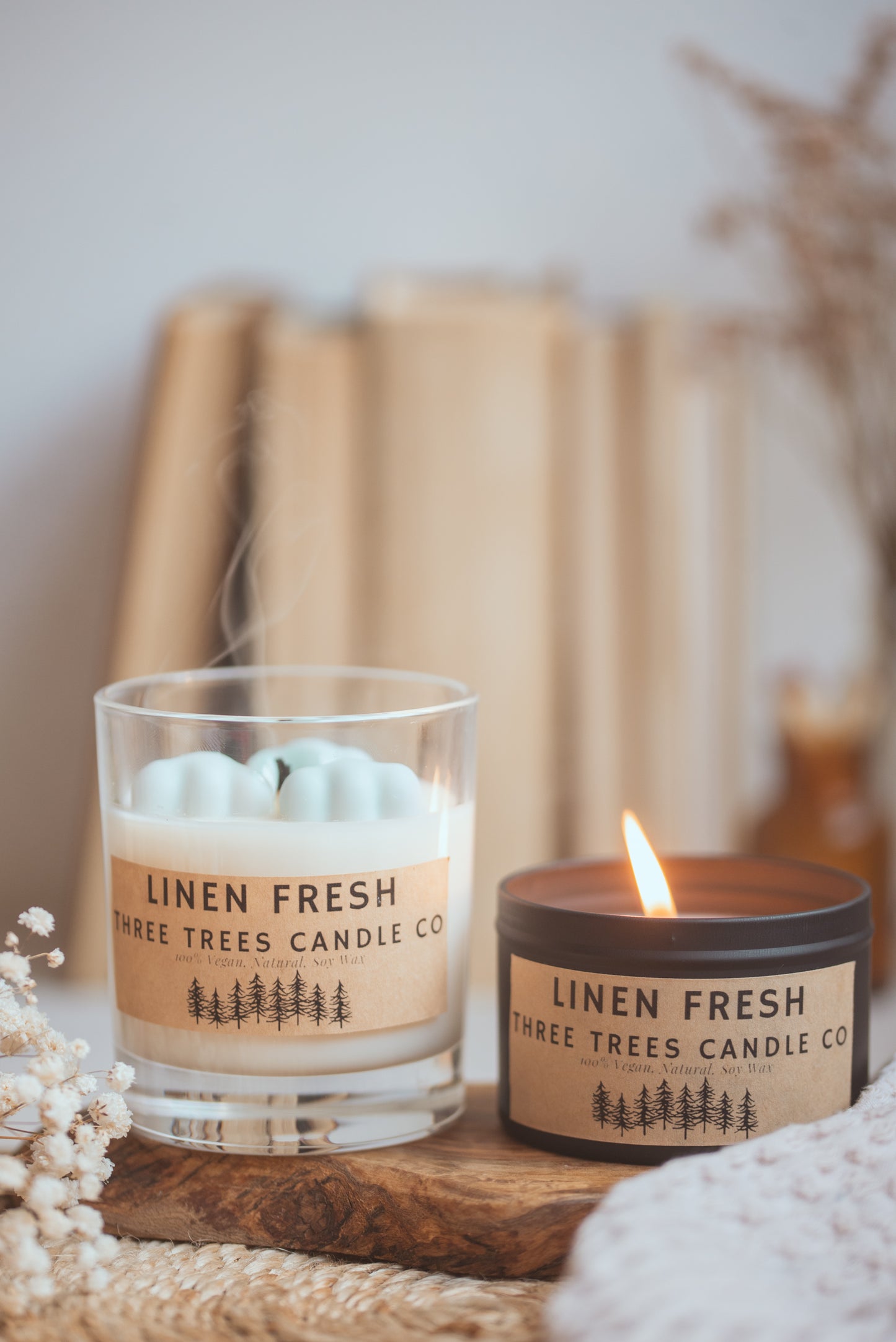 Lit Linen Fresh soy candle creating a crisp and cozy ambiance