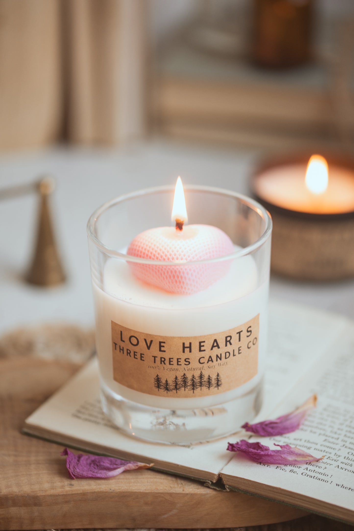 Lit Love Hearts soy candle creating warm romantic ambiance