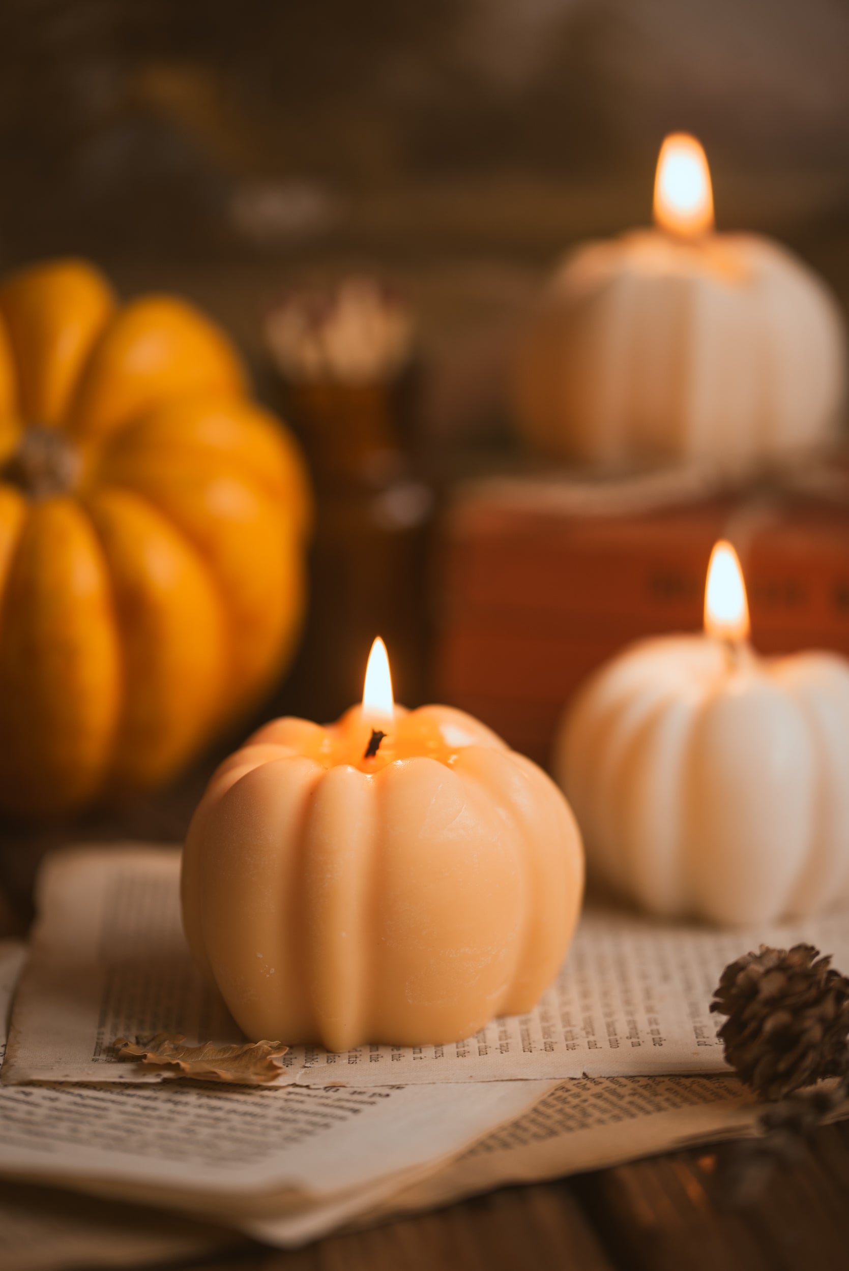 Lit pumpkin candle glowing softly in Halloween ambiance
