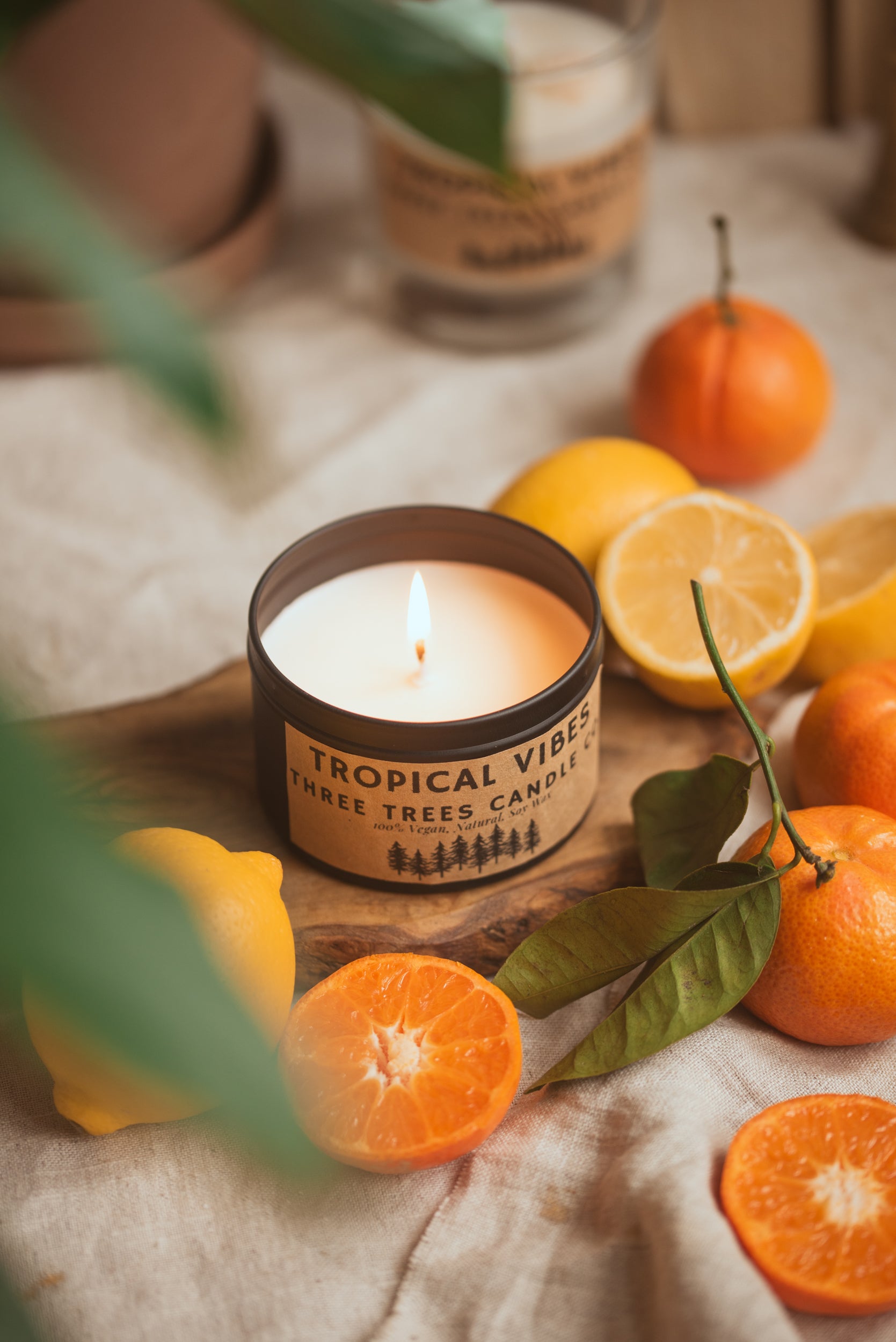 Lit Tropical Vibes candle creating warm, tropical ambiance