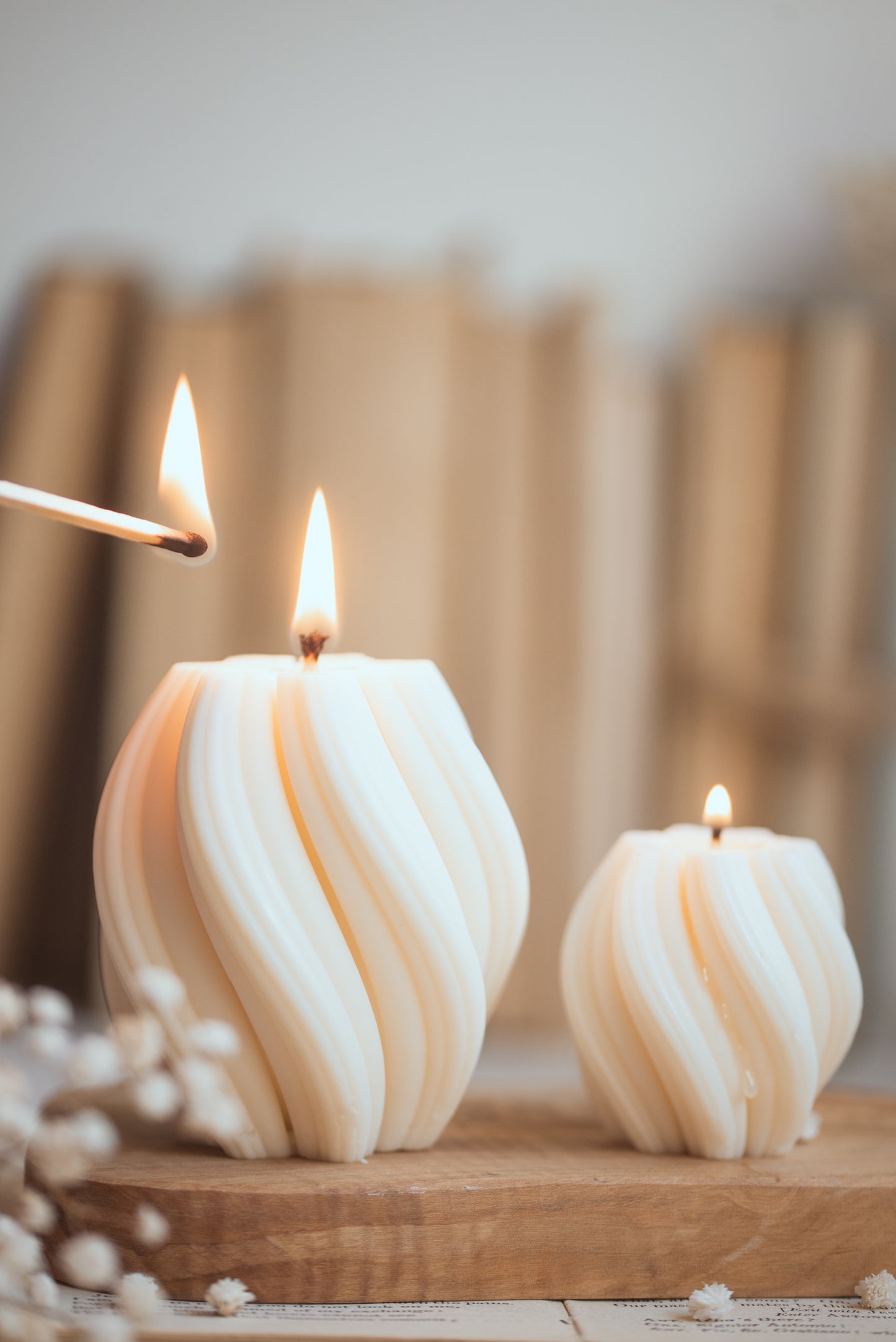 Lit twist-shaped soy candle creating warm and cozy ambiance