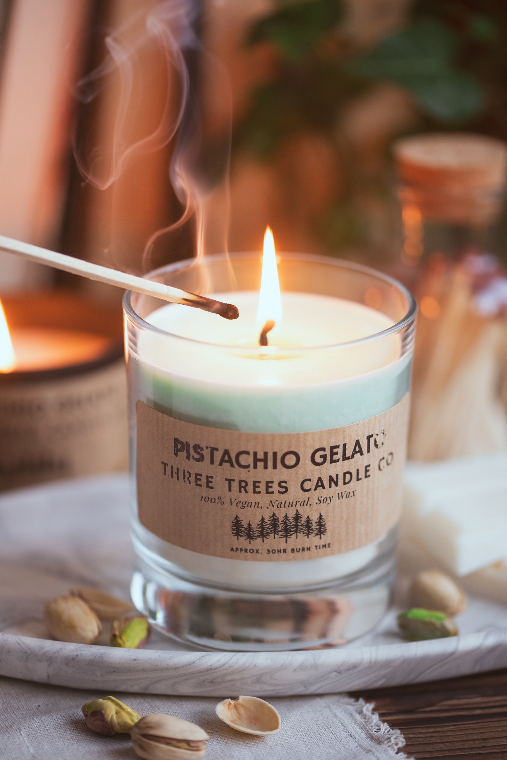 Pistachio gelato scented soy wax candle in a glass jar