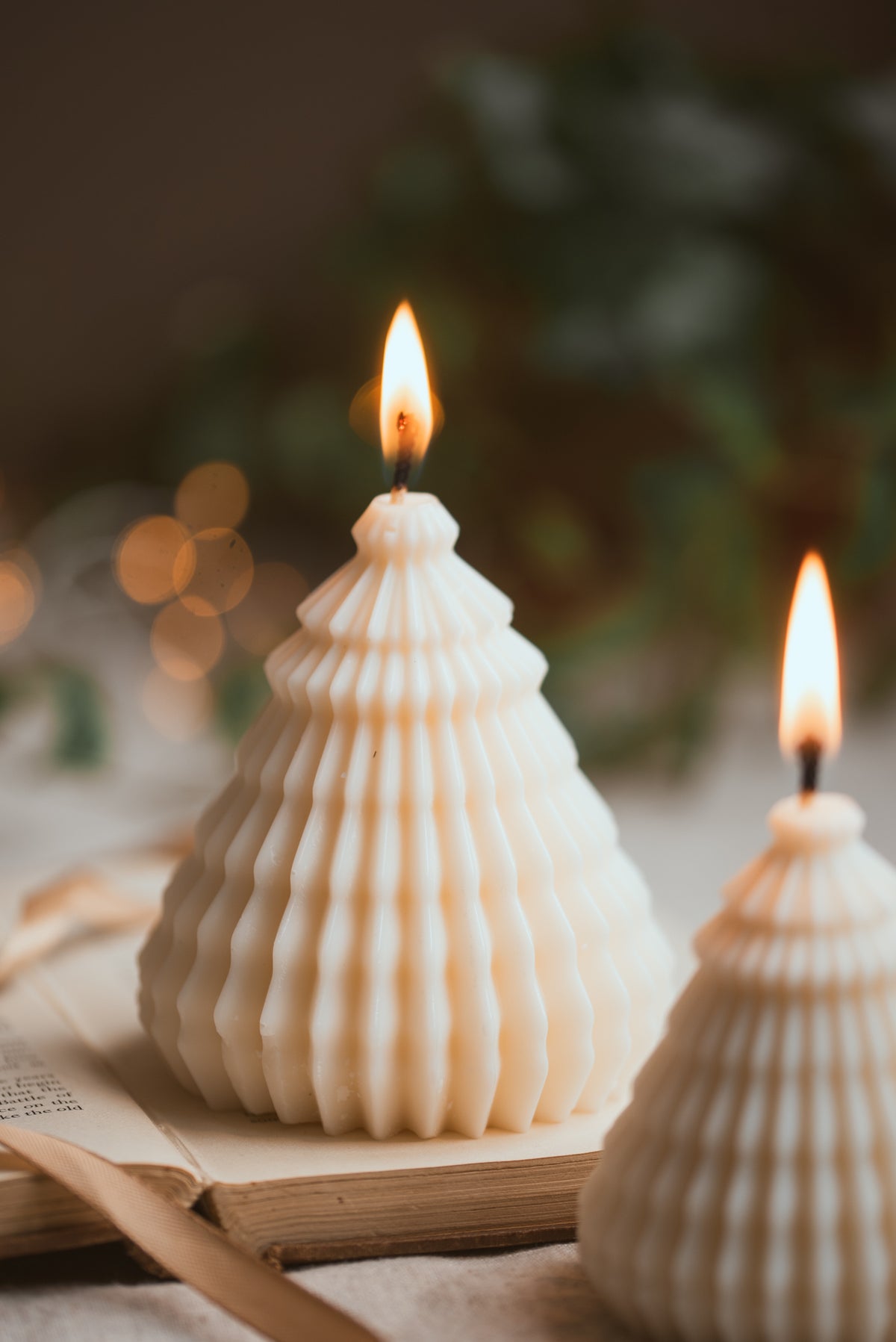 Sculptural layered Christmas tree soy wax candle with festive design