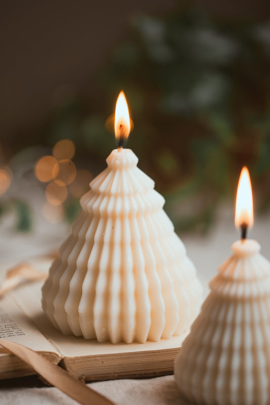 Sculptural layered Christmas tree soy wax candle with festive design