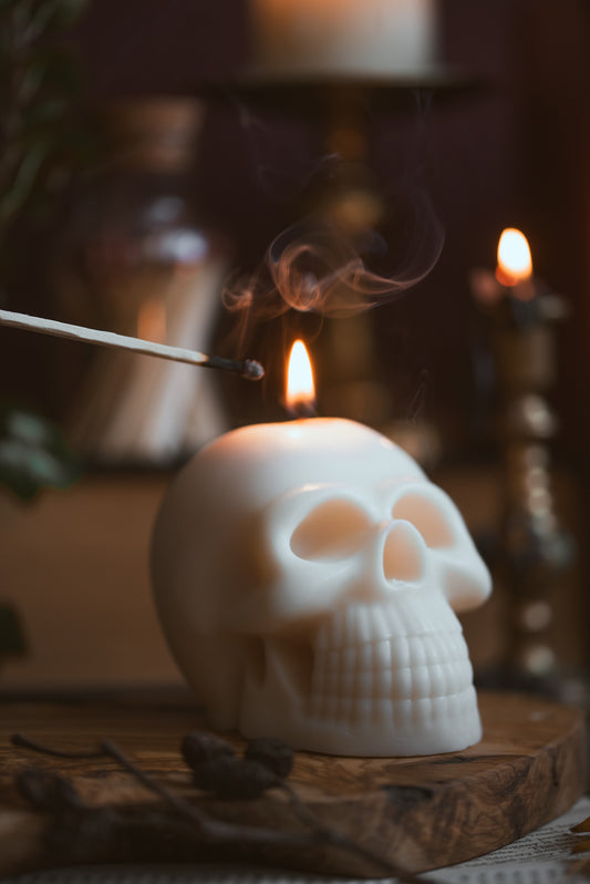 Skull shaped soy wax candle lit