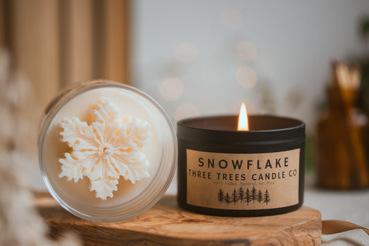 Snowflake scented soy wax candle in decorative jar
