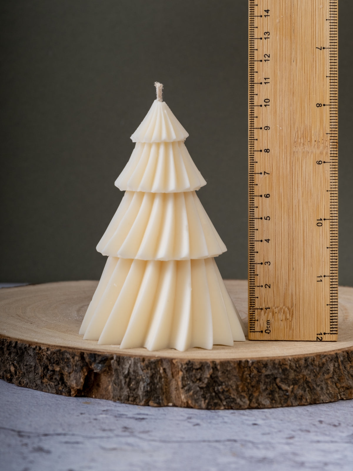 Minimalist Christmas tree candle styled with modern holiday decor