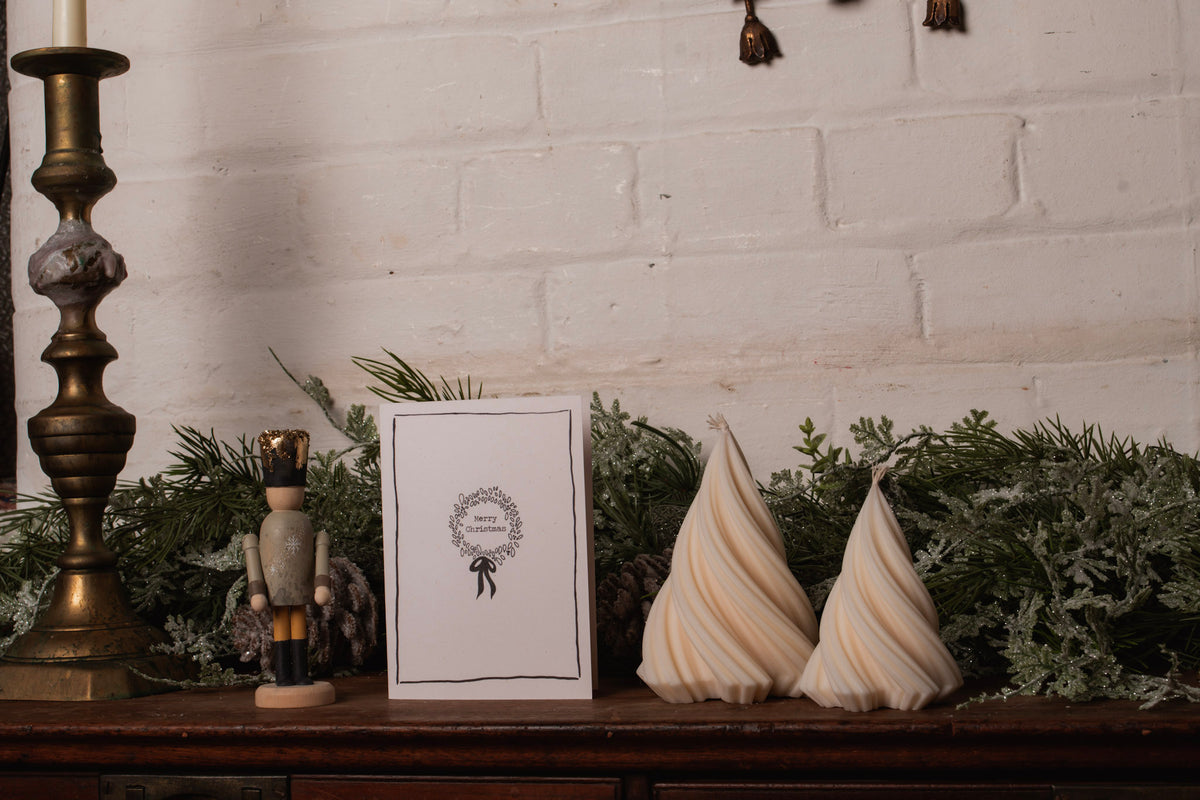 Twist Christmas tree candle styled on festive holiday table
