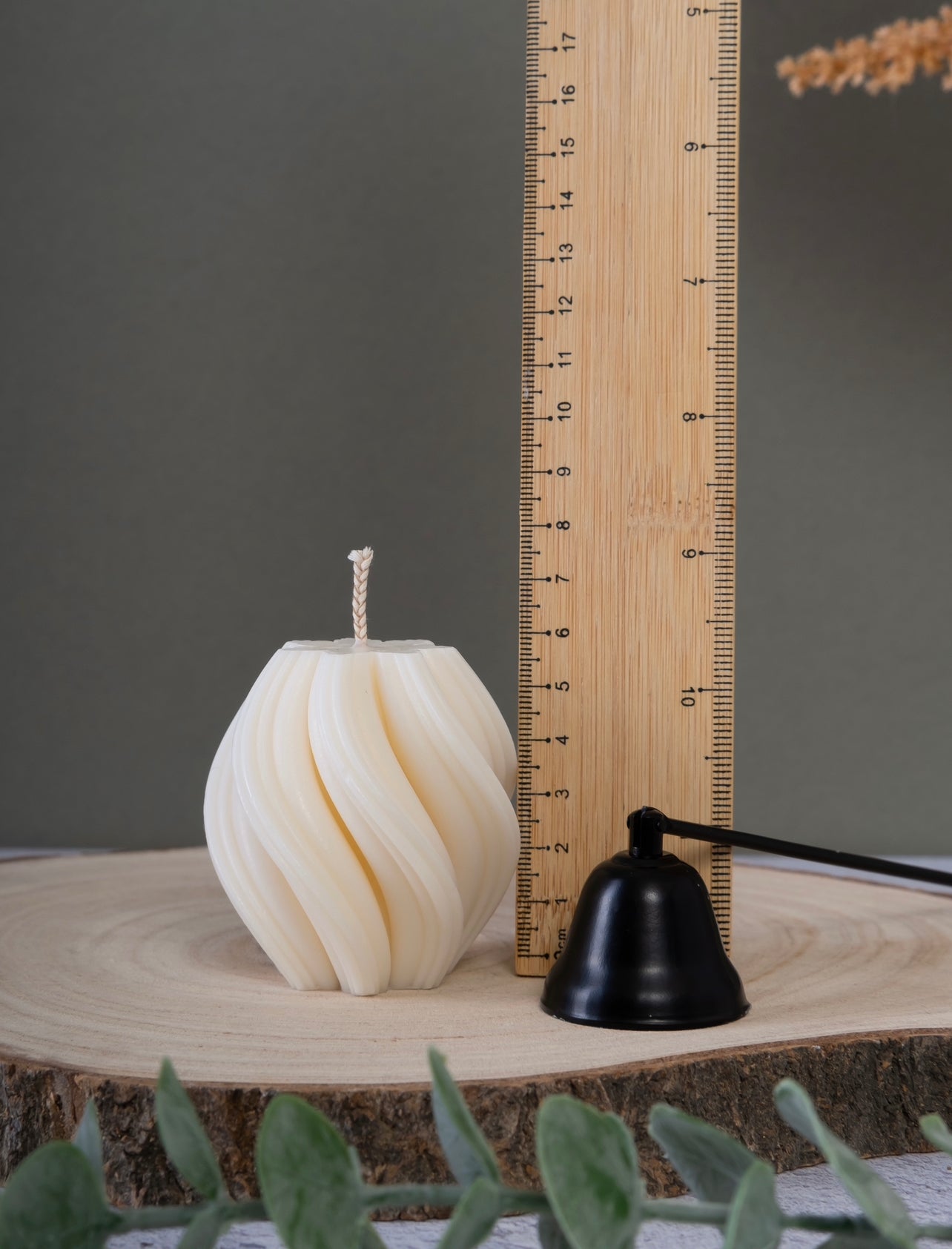 Close-up of small twist candle showing height