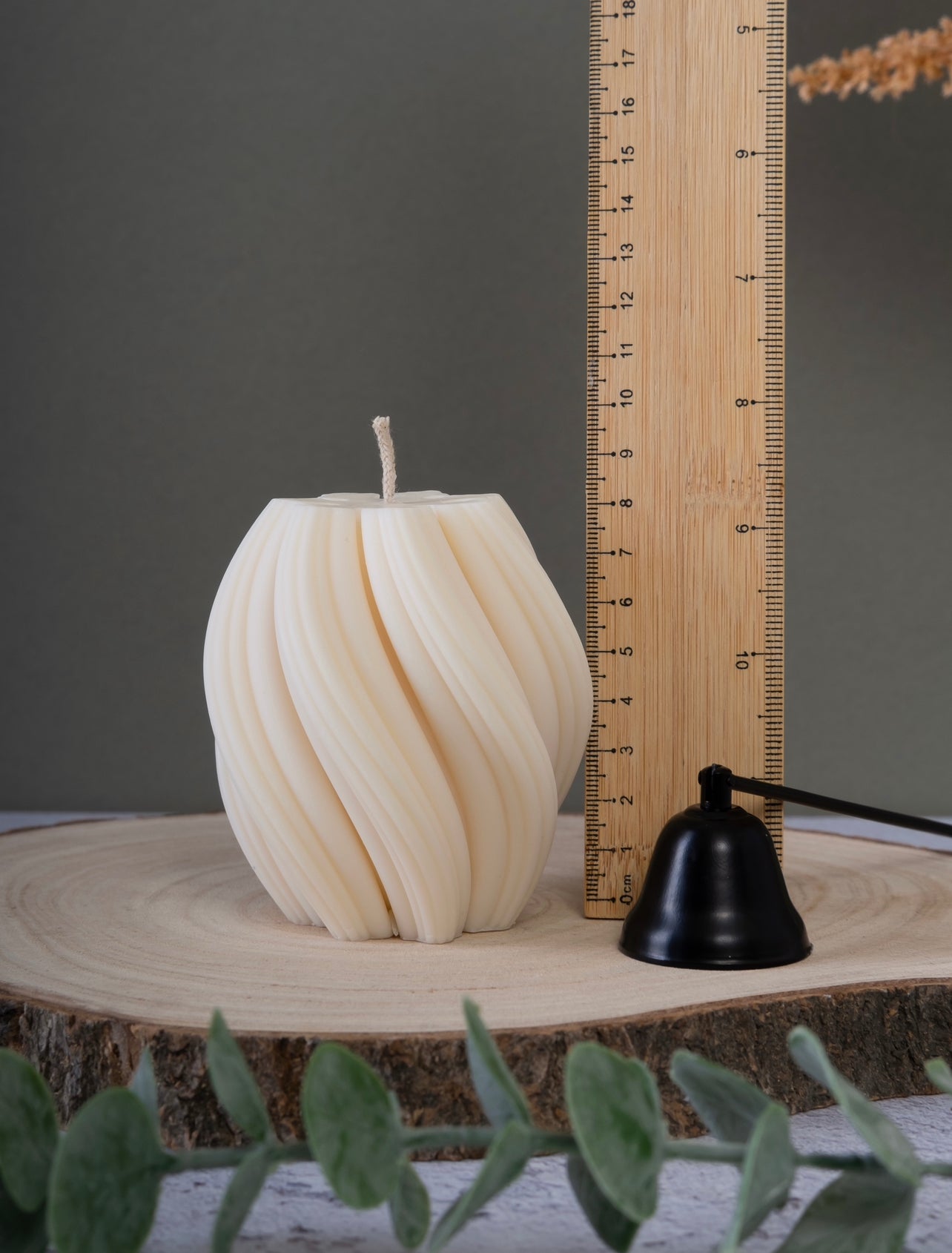 Close-up of tall twist candle showing height